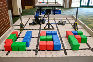 USF spelled out on robotics play field