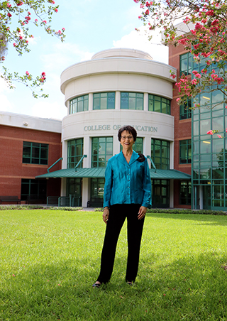 RoseAnne Bowers stands outside of the College of Education