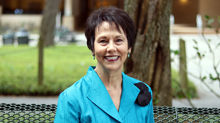 RoseAnne Garcia Bowers sits down outside the College of Education