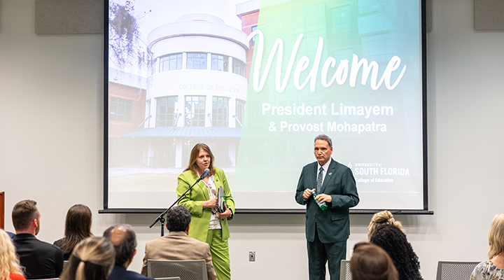 USF President and College of Education Dean speaking at TECO Hall