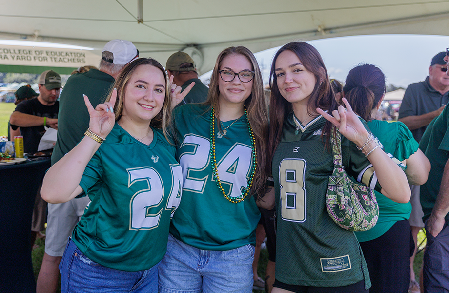 three women wearing USF jerseys