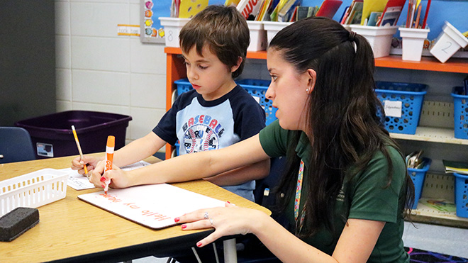 Teacher with student