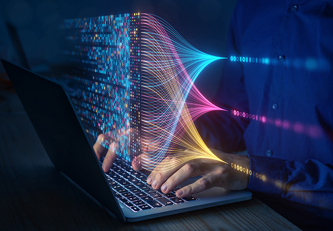 Hands typing on a laptop with a techy colorful overlay