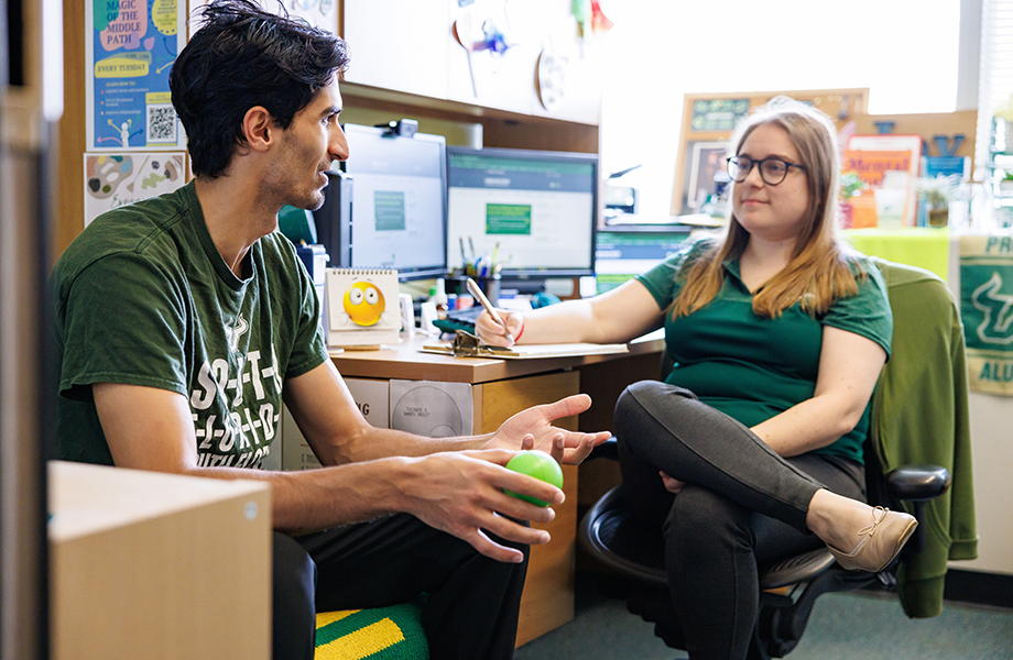 counselor working with college student