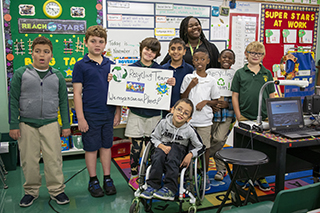 Student teacher with students in an ESE classroom