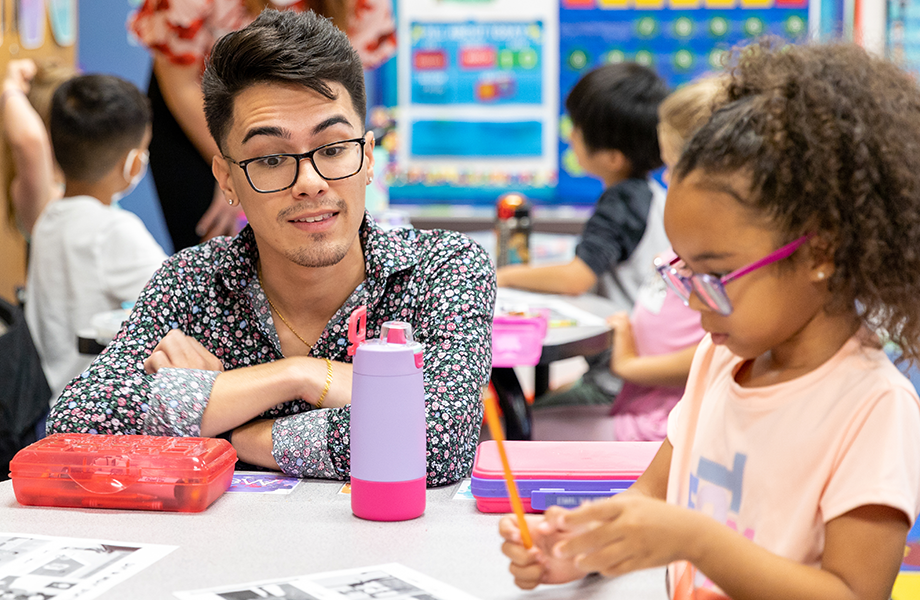 student in couselor education program working with an elementary student