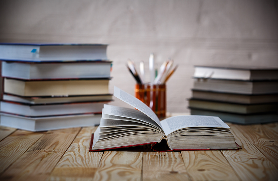 Open books sitting on a table