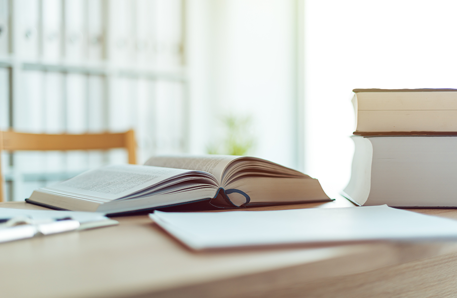 A book sits open on a table