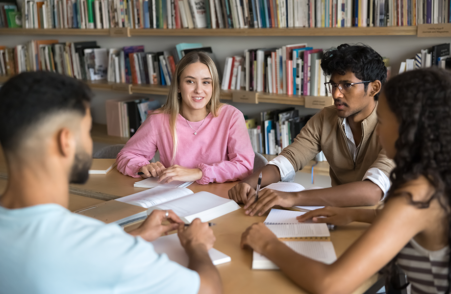 students having discussion at table