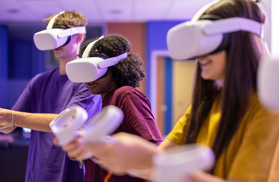 young people wearing VR headsets