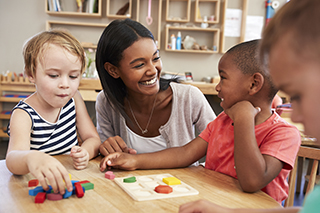 Teacher with preschool students in classroom