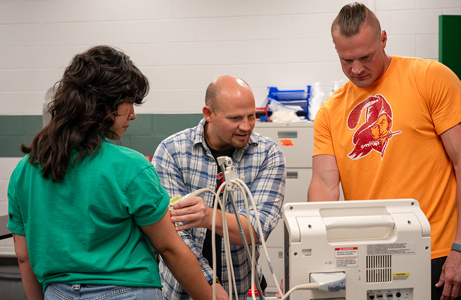 team uses equipment to test client's body composition