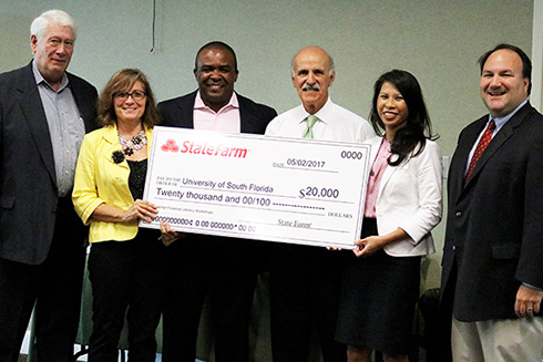 State Farm check presentation group photo