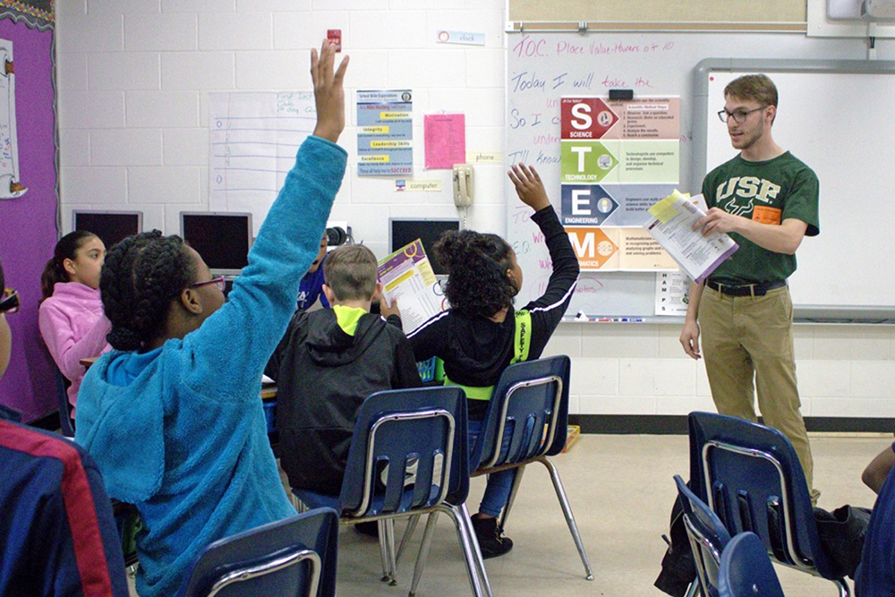 USF Education LLC student Austin Bennett teaching during a service learning event