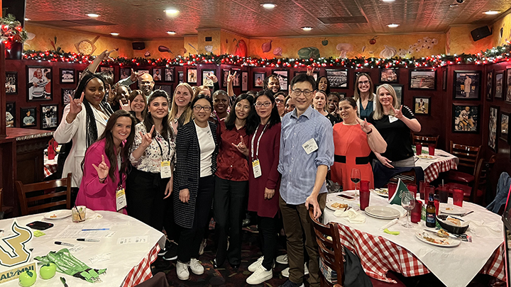 Large group photo at meet the Dean event