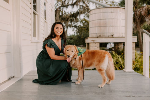 USF doctoral student Cassie D'Addeo and her golden retriever, Kai.