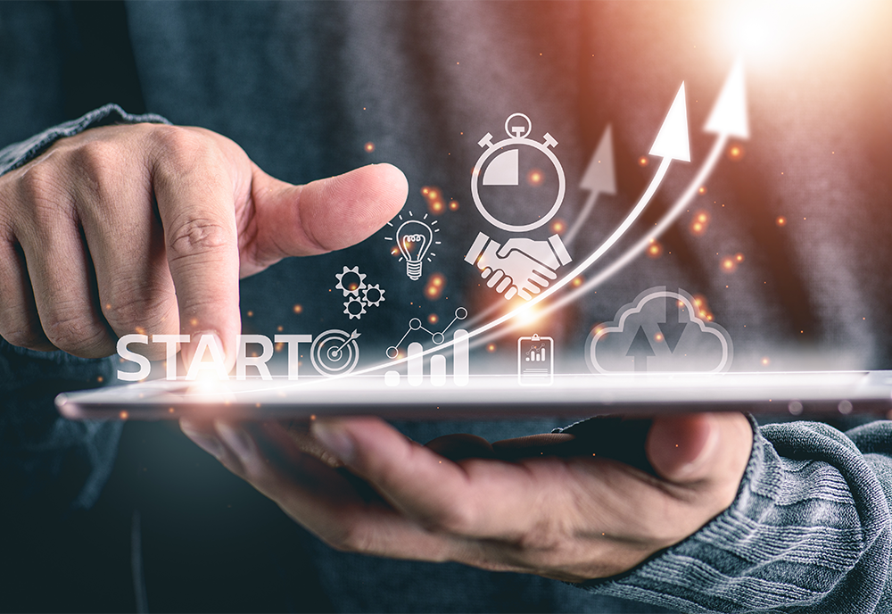 Hands holding graphic of startup figuratively growing 