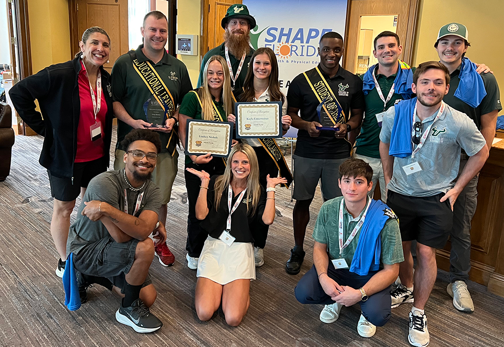 USF physical education faculty and students group photo with awards