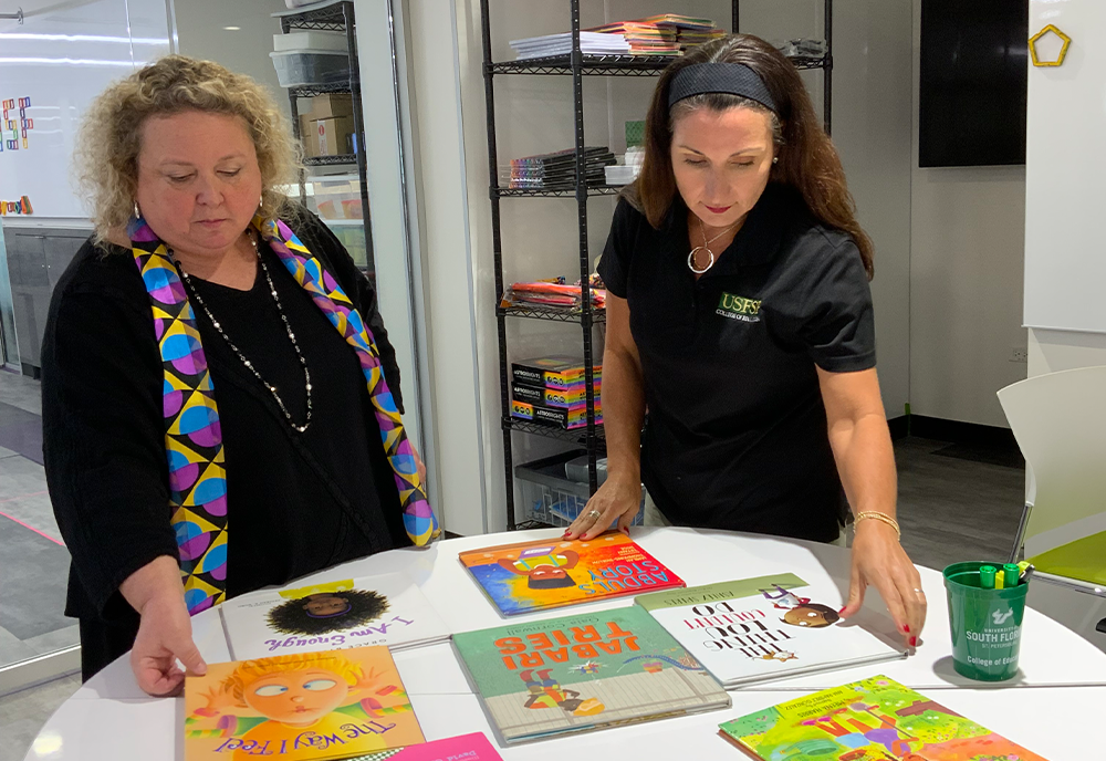 AnnMarie and Susan organizing books