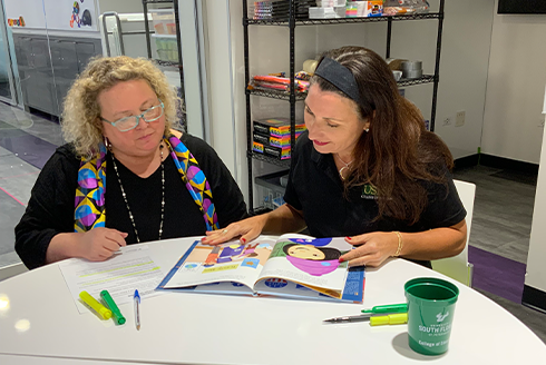 AnnMarie and Susan reading a book