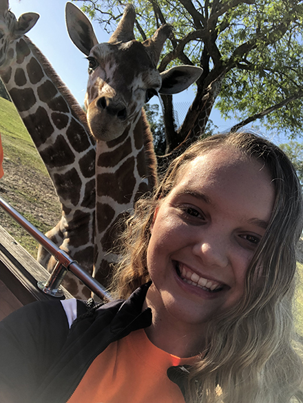 Julia Genkinger pictured with a giraffe