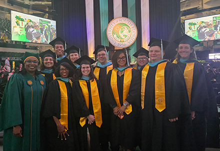 Isaac Jeffrey Neiger and cohort at graduation