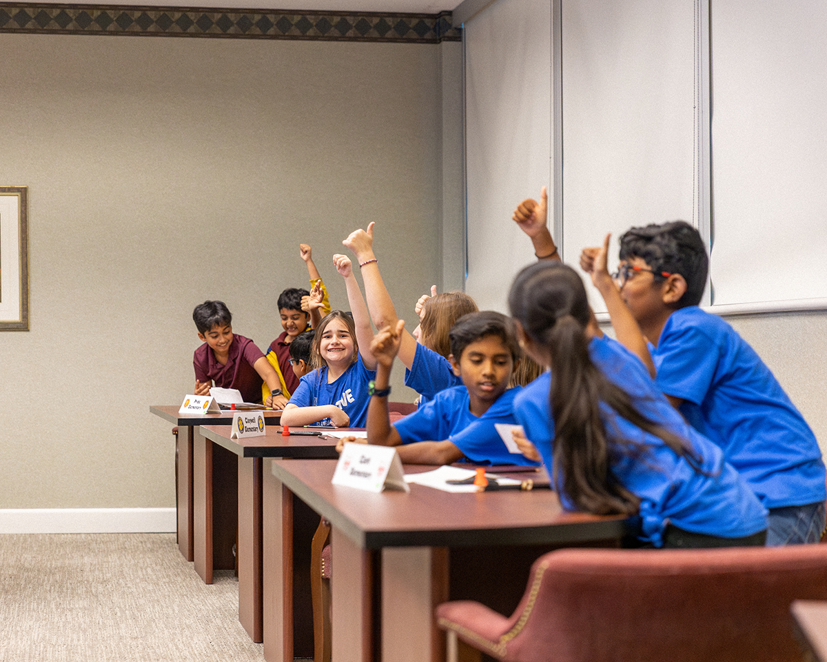 Students putting thumbs up
