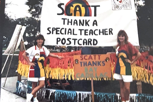 two SCATT students with sign saying