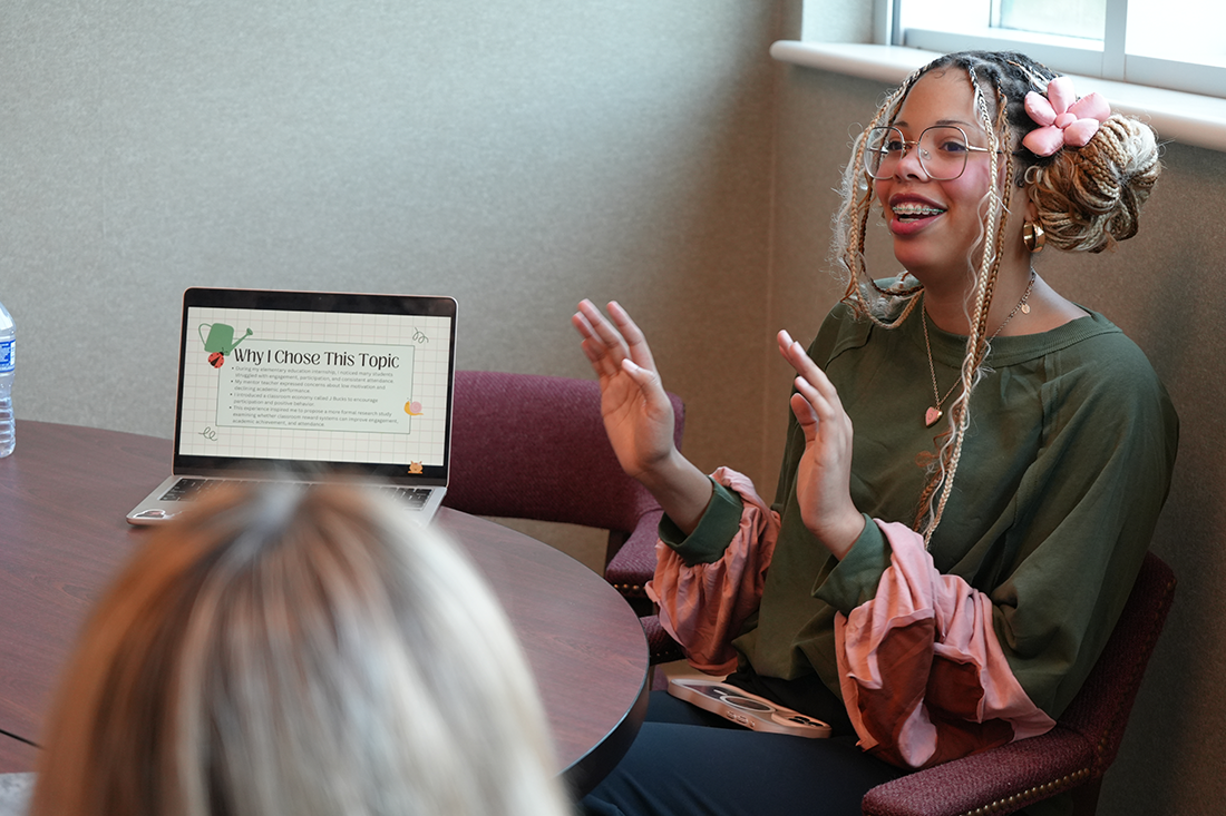 Undergraduate presenting her research