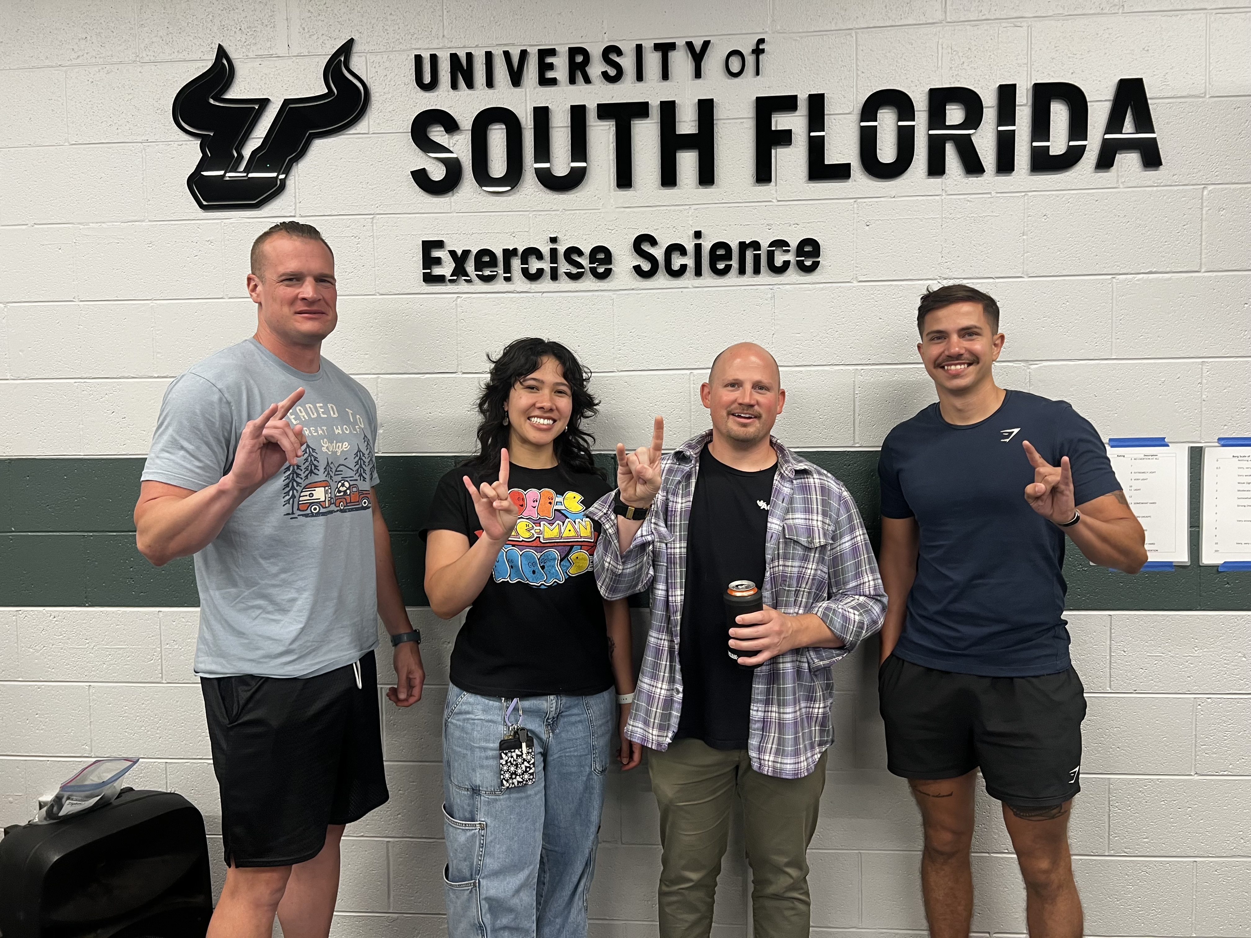 Issa with faculty in exercise science building