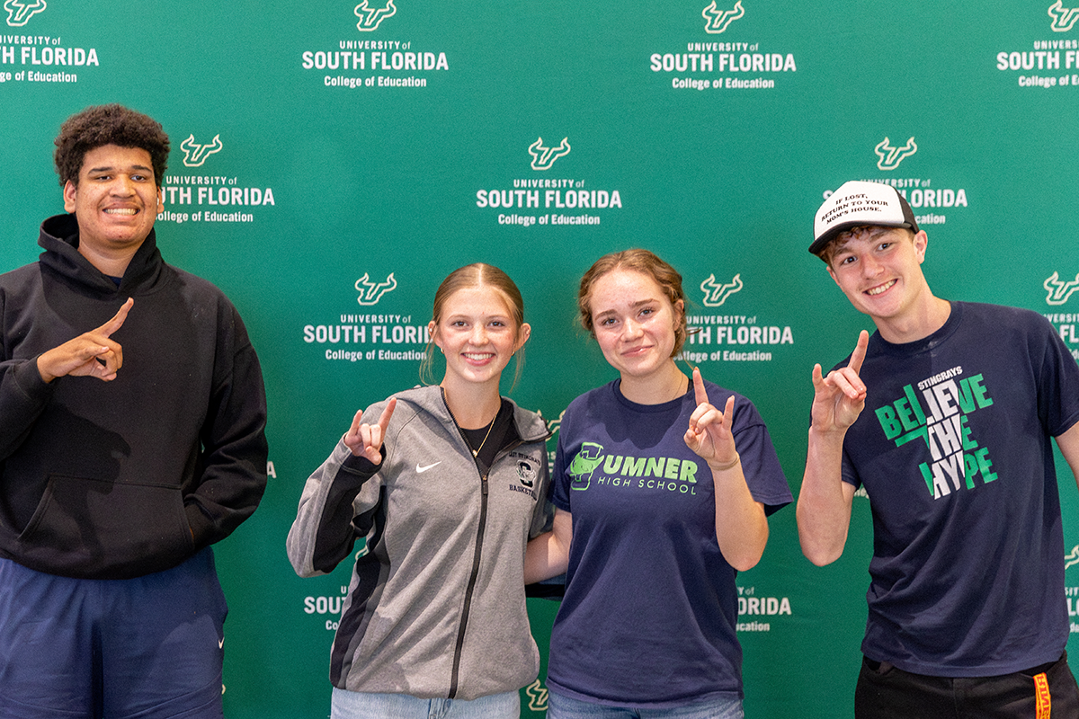 High School students throwing up USF Bulls hand sign
