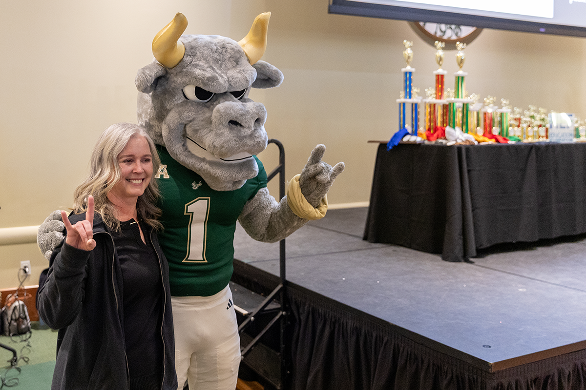 Rocky standing with the awards