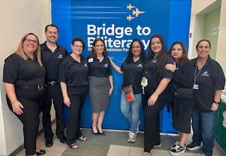 a group of smiling district leaders