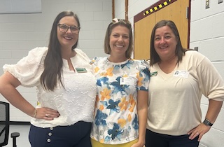 three teachers smiling