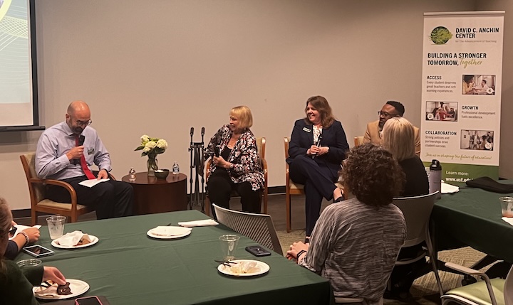 a picture of four faculty members