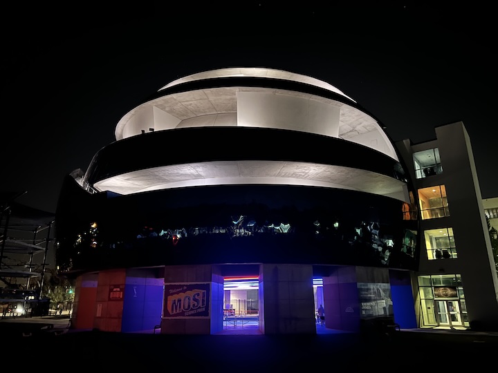 a picture of the outside of the mosi museum at night