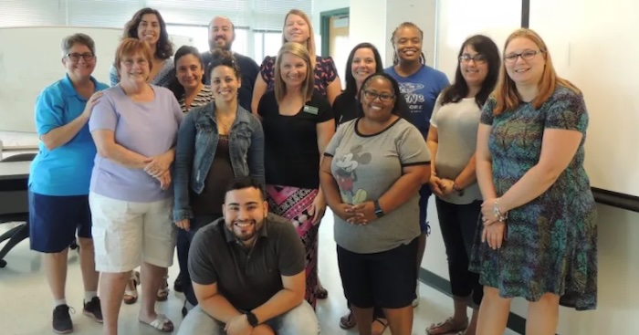 teachers smiling at the camera