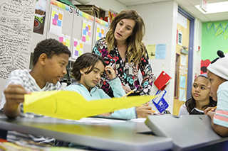 Teacher with students in classroom