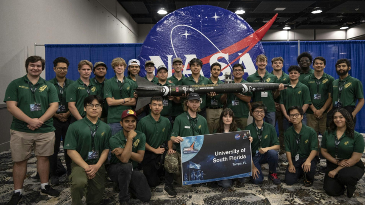 SOAR group posing in front of NASA sign