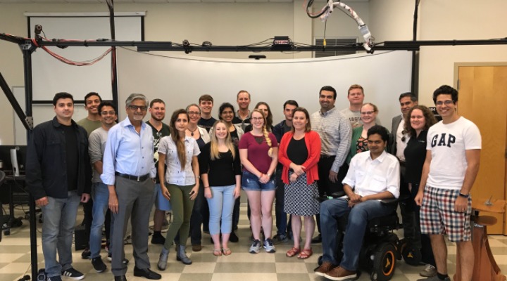 Group of faculty and staff posing for a picture