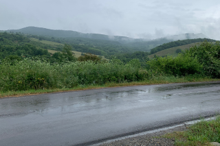 Wet road with mountain background