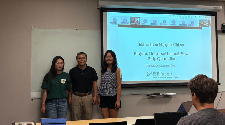 Dr. Cao standing with students (2)