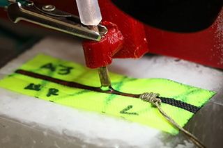 sewing copper components into fabric