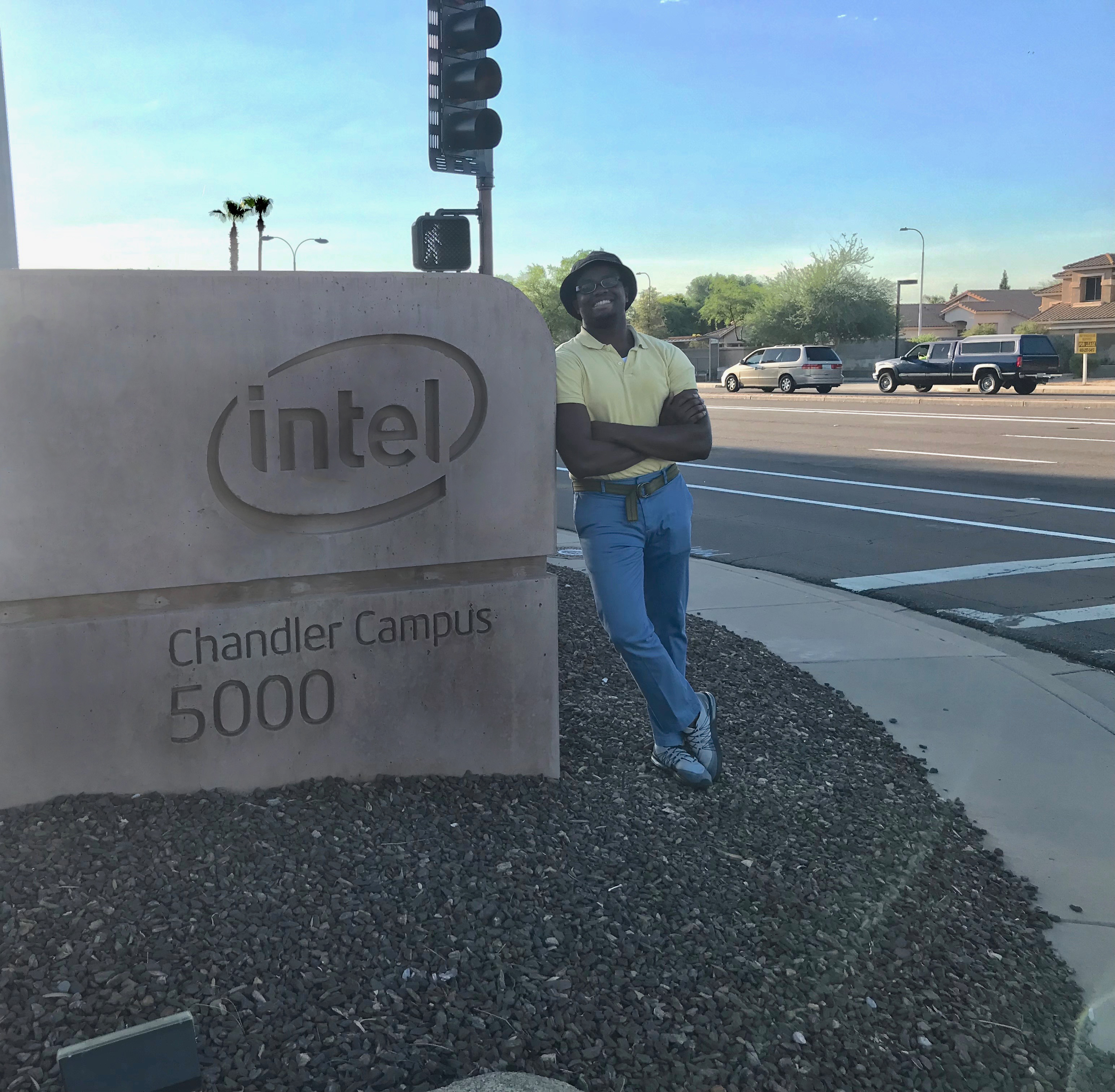 Ossie Douglas stands in front of Intel's Chandler campus sign
