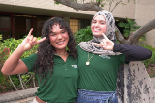 Engineer Ambassadors posing with bulls hang sign