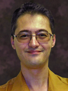 headshot of professor takshi