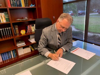 Dean Bishop Signing the IAE's new RDAs