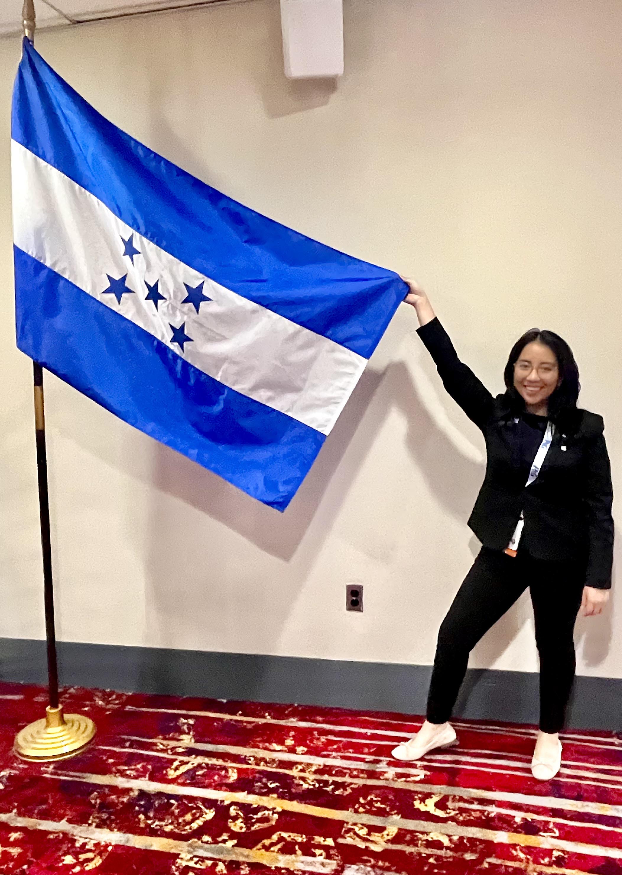 Amy Chu Ramos with Flag
