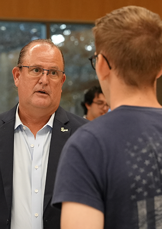 student talks with representative about careers in national security