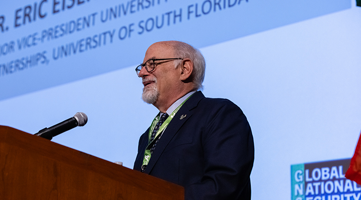 Dr. Eric Eisenberg Senior VP at USF, addresses the conference
